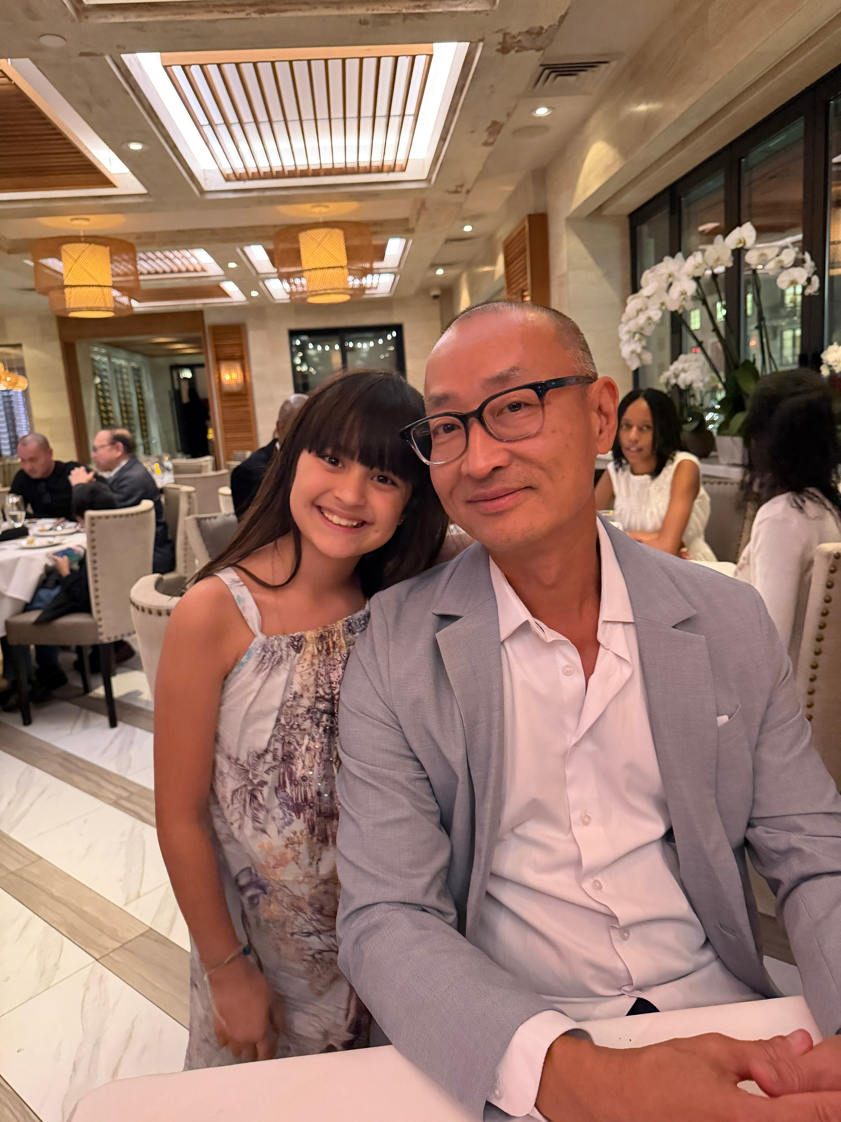 Dad and daughter at elegant restaurant