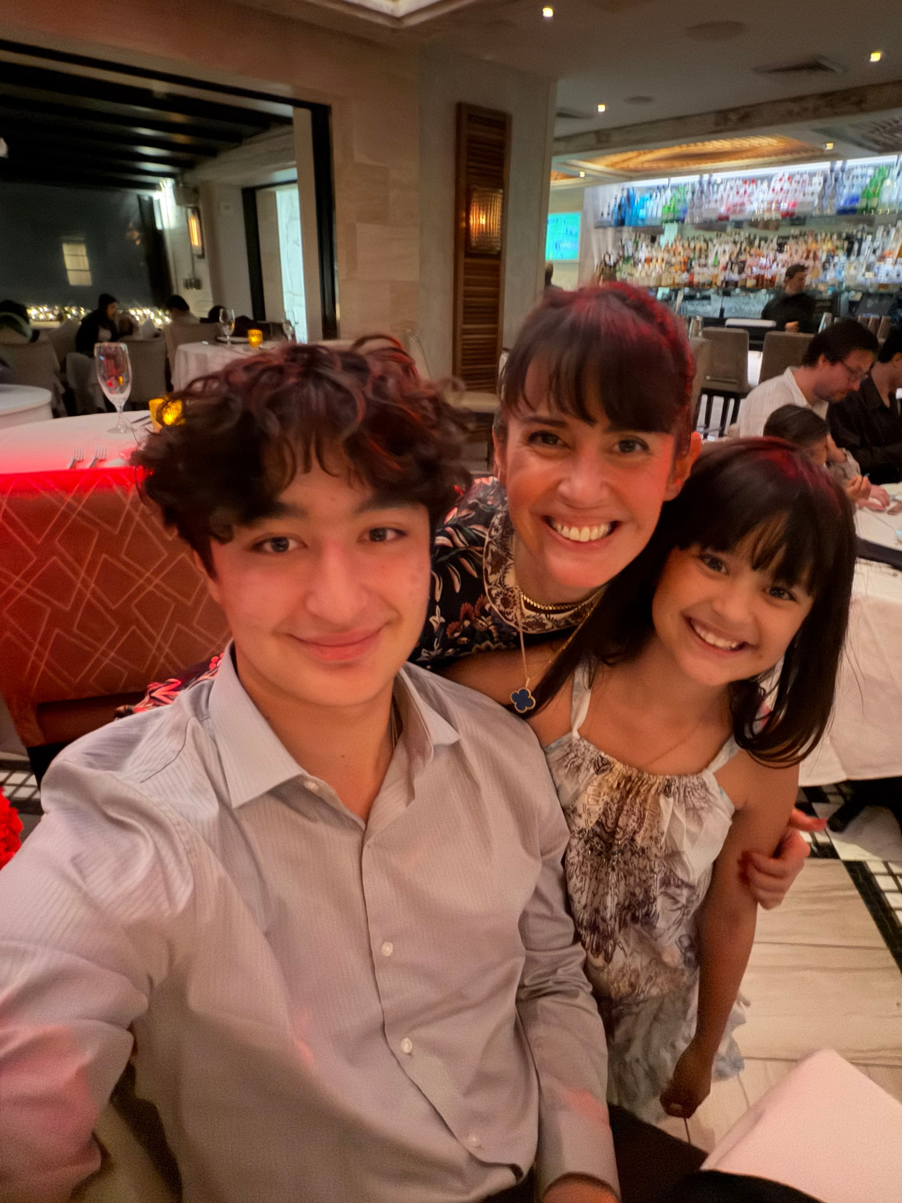 Mom with teen son and daughter at restaurant