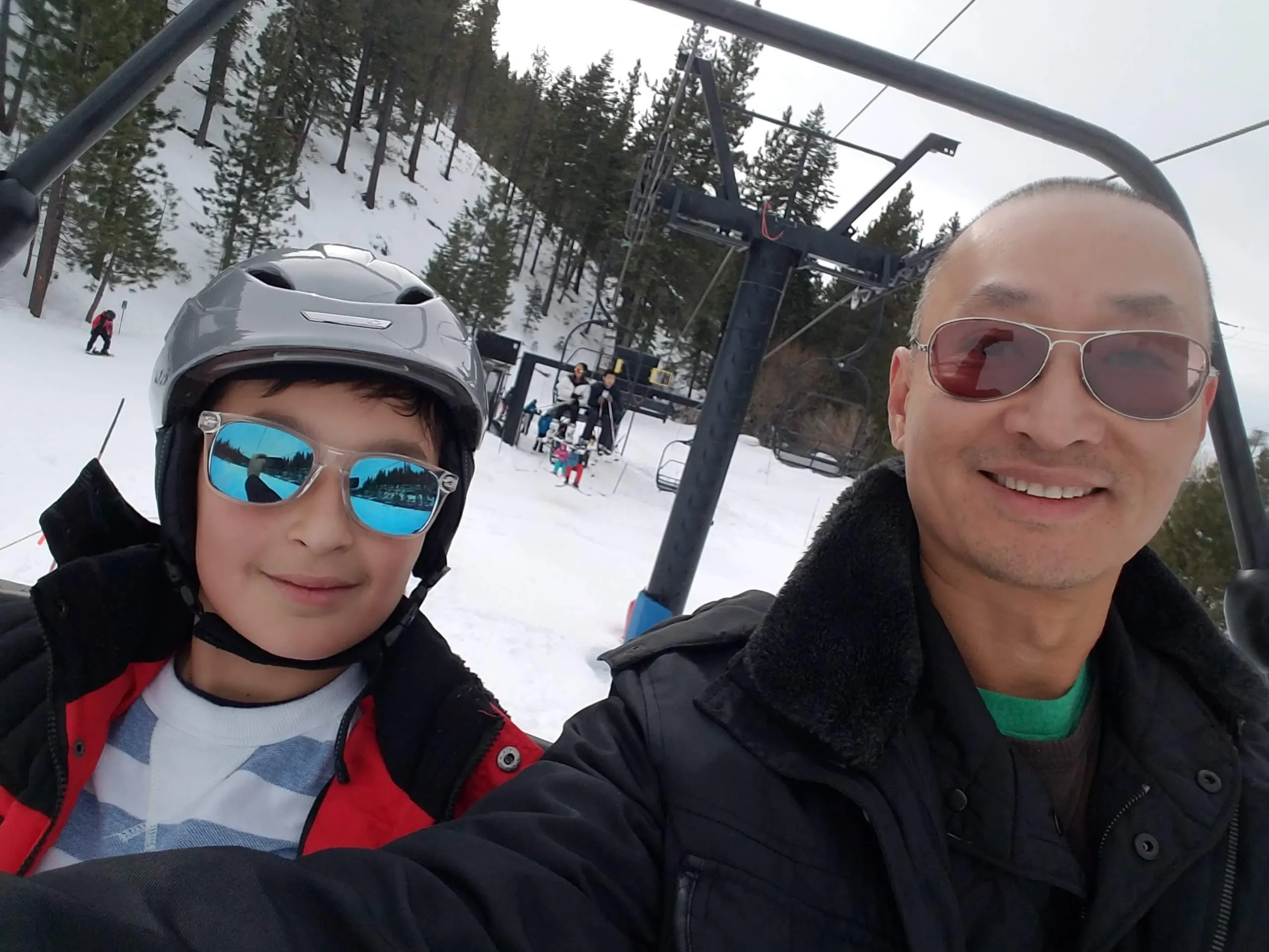 Dad and son on a ski lift