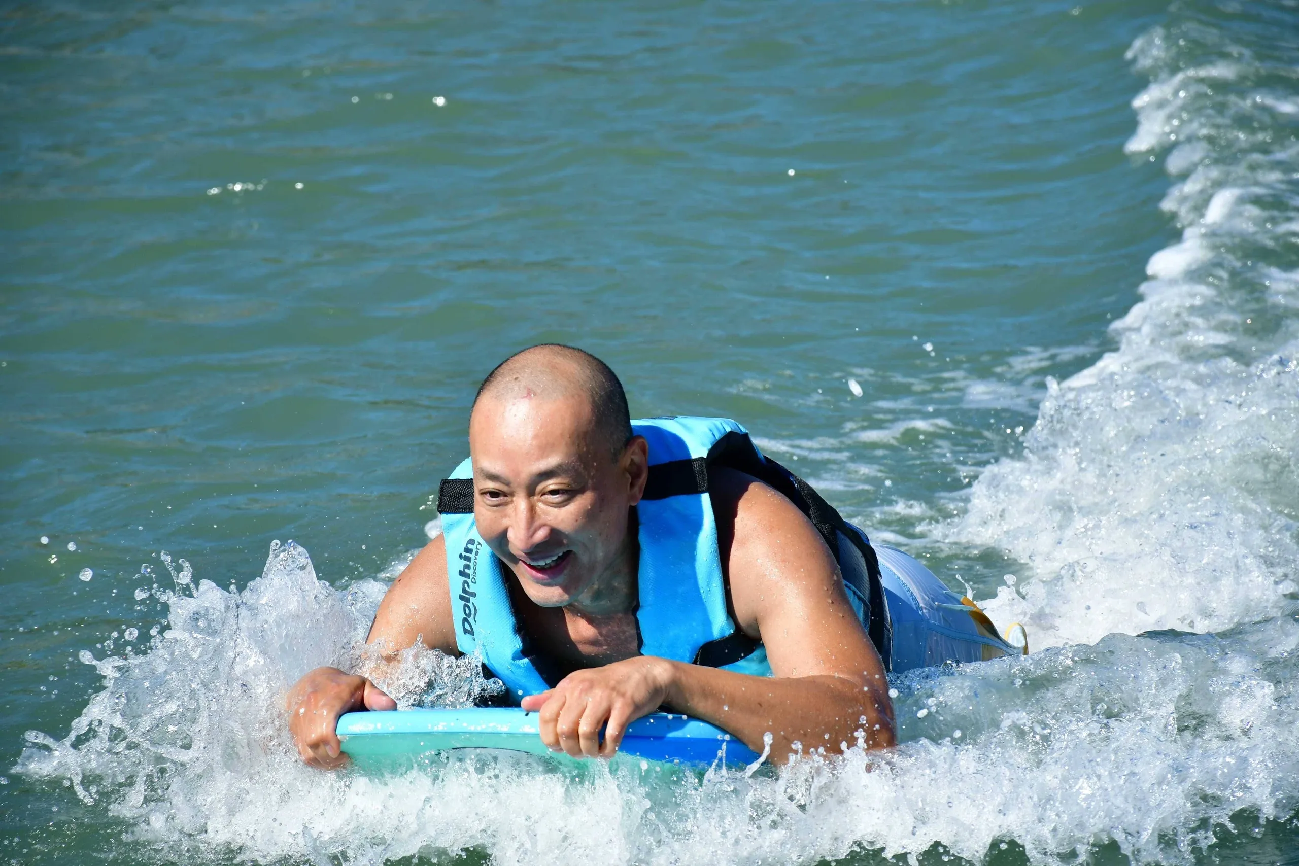 Dad bodyboarding in the ocean